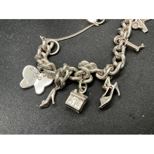 48 - 2 SILVER CHARM BRACELETS (TESTED) WITH A TOTAL OF 22 SILVER & WHITE METAL CHARMS TW106.2G - 1 LOCKET... 