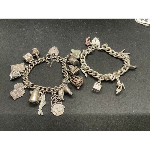 48 - 2 SILVER CHARM BRACELETS (TESTED) WITH A TOTAL OF 22 SILVER & WHITE METAL CHARMS TW106.2G - 1 LOCKET... 