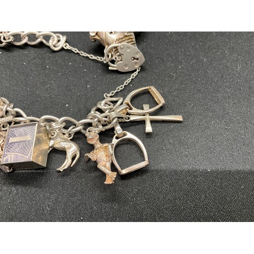 50 - SILVER CHARM BRACELET (TESTED) WITH 17 SILVER & WHITE METAL CHARMS W66.1G - LOCKET & CHAIN IS ENGLIS... 