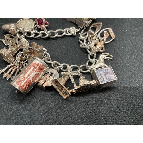 50 - SILVER CHARM BRACELET (TESTED) WITH 17 SILVER & WHITE METAL CHARMS W66.1G - LOCKET & CHAIN IS ENGLIS... 