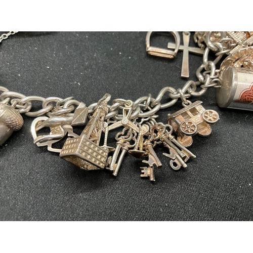 50 - SILVER CHARM BRACELET (TESTED) WITH 17 SILVER & WHITE METAL CHARMS W66.1G - LOCKET & CHAIN IS ENGLIS... 