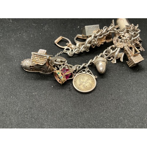 50 - SILVER CHARM BRACELET (TESTED) WITH 17 SILVER & WHITE METAL CHARMS W66.1G - LOCKET & CHAIN IS ENGLIS... 