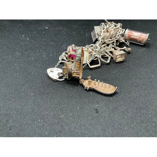 50 - SILVER CHARM BRACELET (TESTED) WITH 17 SILVER & WHITE METAL CHARMS W66.1G - LOCKET & CHAIN IS ENGLIS... 