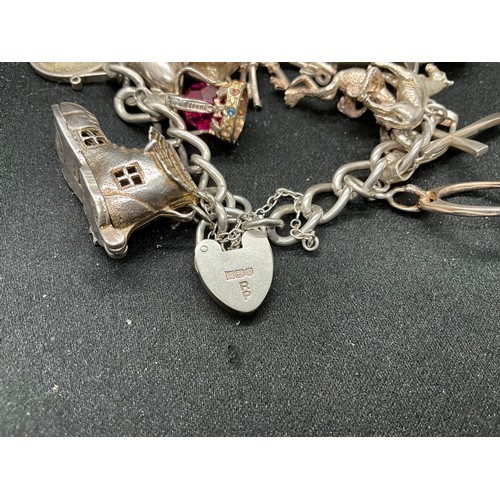 50 - SILVER CHARM BRACELET (TESTED) WITH 17 SILVER & WHITE METAL CHARMS W66.1G - LOCKET & CHAIN IS ENGLIS... 