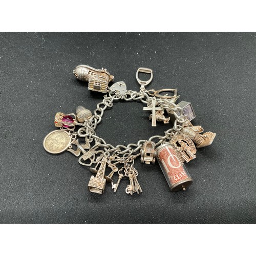 50 - SILVER CHARM BRACELET (TESTED) WITH 17 SILVER & WHITE METAL CHARMS W66.1G - LOCKET & CHAIN IS ENGLIS... 