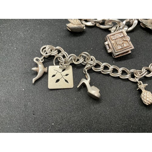 51 - 2 SILVER CHARM BRACELETS (TESTED) WITH A TOTAL OF 12 SILVER & WHITE METAL CHARMS TW62.4G - 1 CLASP I... 