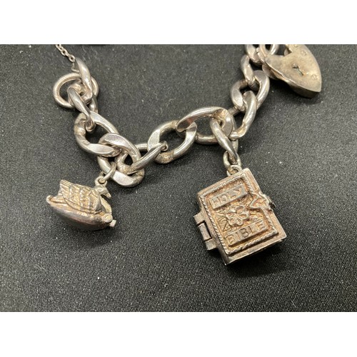 51 - 2 SILVER CHARM BRACELETS (TESTED) WITH A TOTAL OF 12 SILVER & WHITE METAL CHARMS TW62.4G - 1 CLASP I... 