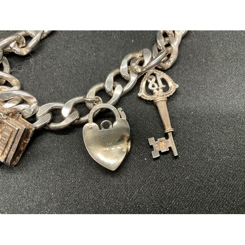 51 - 2 SILVER CHARM BRACELETS (TESTED) WITH A TOTAL OF 12 SILVER & WHITE METAL CHARMS TW62.4G - 1 CLASP I... 