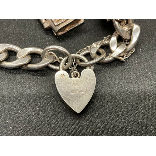 51 - 2 SILVER CHARM BRACELETS (TESTED) WITH A TOTAL OF 12 SILVER & WHITE METAL CHARMS TW62.4G - 1 CLASP I... 