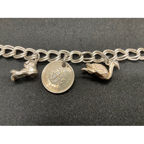 52 - 2 SILVER CHARM BRACELETS (TESTED) WITH A TOTAL OF 20 SILVER & WHITE METAL CHARMS W38.4G - BOTH LOCKE... 