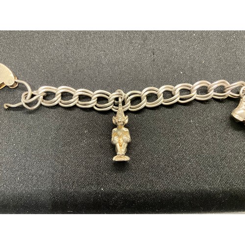 52 - 2 SILVER CHARM BRACELETS (TESTED) WITH A TOTAL OF 20 SILVER & WHITE METAL CHARMS W38.4G - BOTH LOCKE... 