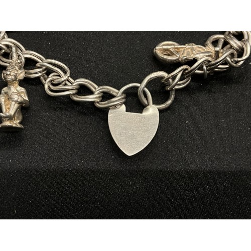 52 - 2 SILVER CHARM BRACELETS (TESTED) WITH A TOTAL OF 20 SILVER & WHITE METAL CHARMS W38.4G - BOTH LOCKE... 