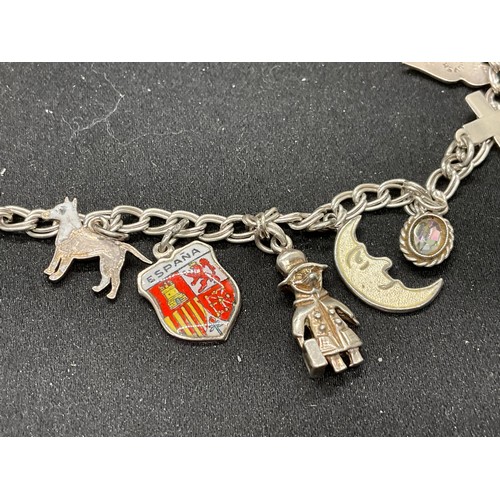 52 - 2 SILVER CHARM BRACELETS (TESTED) WITH A TOTAL OF 20 SILVER & WHITE METAL CHARMS W38.4G - BOTH LOCKE... 