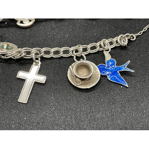52 - 2 SILVER CHARM BRACELETS (TESTED) WITH A TOTAL OF 20 SILVER & WHITE METAL CHARMS W38.4G - BOTH LOCKE... 