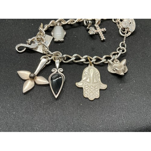 54 - 2 SILVER CHARM BRACELETS (TESTED) WITH A TOTAL OF 20 SILVER & WHITE METAL CHARMS TW60.6G - 1 HOOP HO... 
