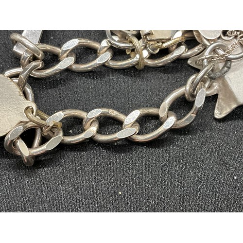 54 - 2 SILVER CHARM BRACELETS (TESTED) WITH A TOTAL OF 20 SILVER & WHITE METAL CHARMS TW60.6G - 1 HOOP HO... 