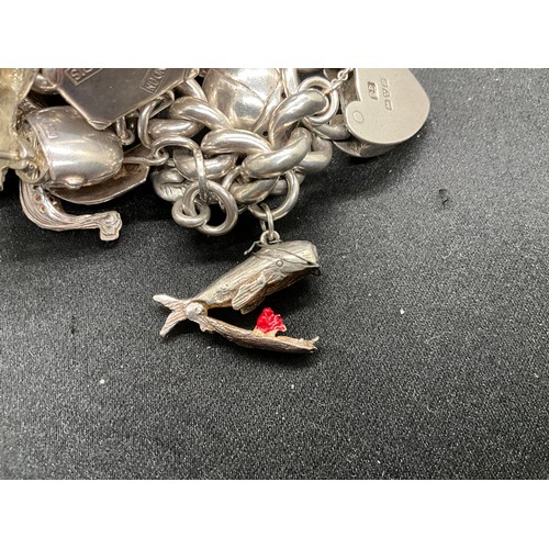 55 - SILVER CHARM BRACELET (TESTED) WITH 30 SILVER & WHITE METAL CHARMS TW110.7G - ENGLISH HALLMARK LOCKE... 