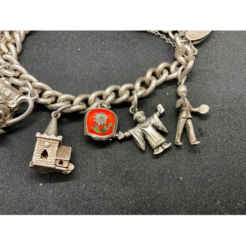 56 - HALLMARKED SILVER CHARM BRACELET WITH 12 SILVER & WHITE METAL CHARMS TW70G - ENGLISH HALLMARK SILVER... 