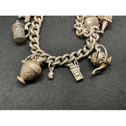 56 - HALLMARKED SILVER CHARM BRACELET WITH 12 SILVER & WHITE METAL CHARMS TW70G - ENGLISH HALLMARK SILVER... 