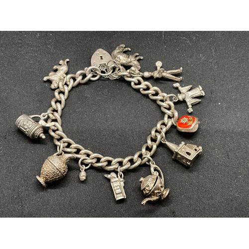 56 - HALLMARKED SILVER CHARM BRACELET WITH 12 SILVER & WHITE METAL CHARMS TW70G - ENGLISH HALLMARK SILVER... 