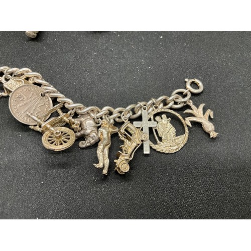 60 - 2 SILVER CHARM BRACELETS (TESTED) WITH A TOTAL OF 30 SILVER & WHITE METAL CHARMS TW93.8G - 1 LOCKET ... 