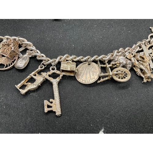 60 - 2 SILVER CHARM BRACELETS (TESTED) WITH A TOTAL OF 30 SILVER & WHITE METAL CHARMS TW93.8G - 1 LOCKET ... 
