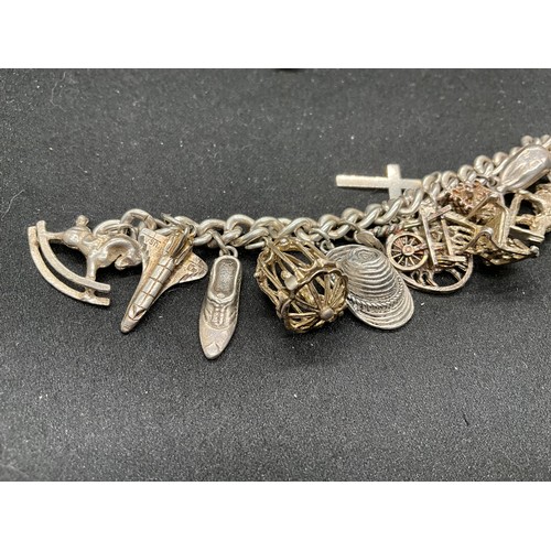 60 - 2 SILVER CHARM BRACELETS (TESTED) WITH A TOTAL OF 30 SILVER & WHITE METAL CHARMS TW93.8G - 1 LOCKET ... 