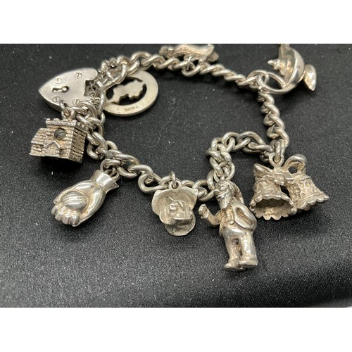 60 - 2 SILVER CHARM BRACELETS (TESTED) WITH A TOTAL OF 30 SILVER & WHITE METAL CHARMS TW93.8G - 1 LOCKET ... 