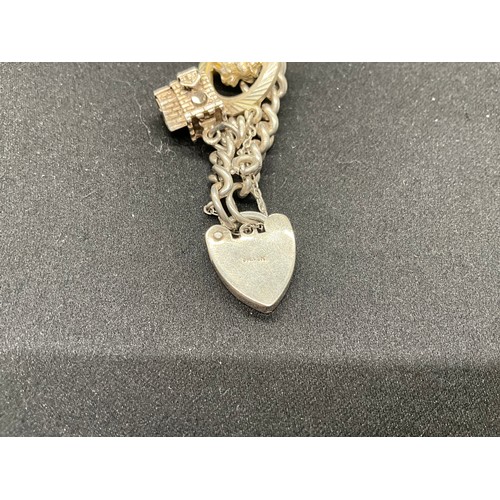 60 - 2 SILVER CHARM BRACELETS (TESTED) WITH A TOTAL OF 30 SILVER & WHITE METAL CHARMS TW93.8G - 1 LOCKET ... 