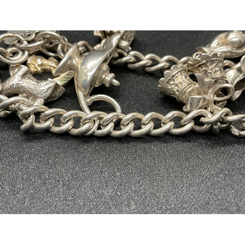 60 - 2 SILVER CHARM BRACELETS (TESTED) WITH A TOTAL OF 30 SILVER & WHITE METAL CHARMS TW93.8G - 1 LOCKET ... 