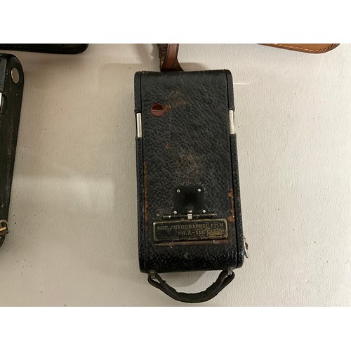 121 - 2 X VINTAGE LEATHER CASED KODAK CAMERAS