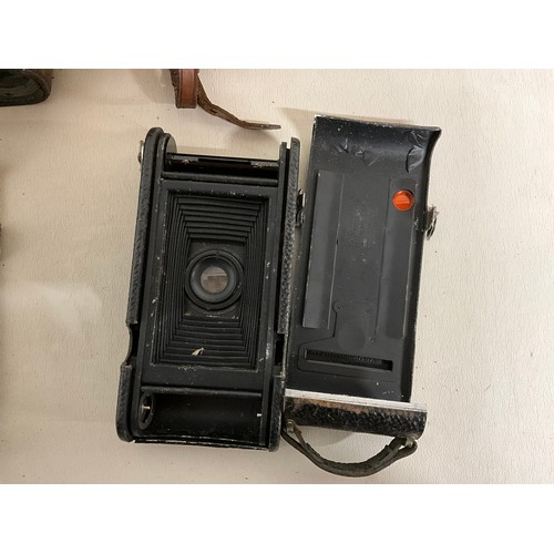 121 - 2 X VINTAGE LEATHER CASED KODAK CAMERAS