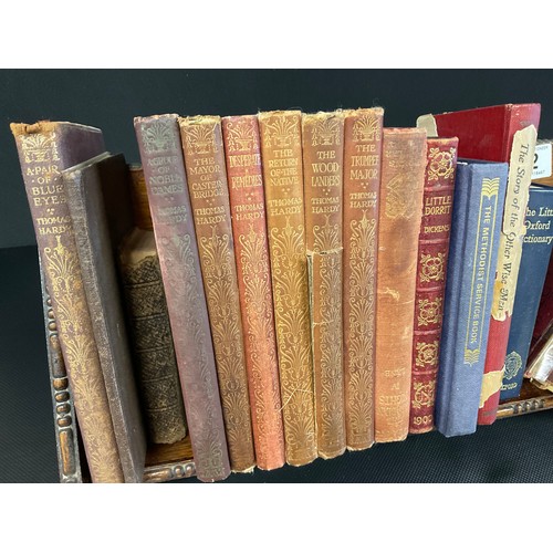 52 - VINTAGE OAK BOOK RACK AND BOOKS - THOMAS HARDY ,DICKENS ETC