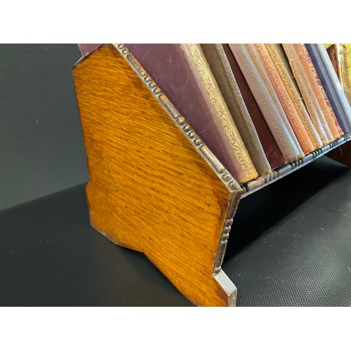 52 - VINTAGE OAK BOOK RACK AND BOOKS - THOMAS HARDY ,DICKENS ETC