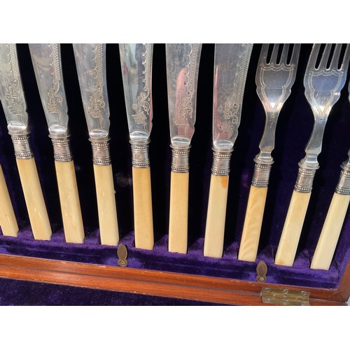 57 - ANTIQUE MAHOGANY CASED SET OF FISH KNIVES AND FORKS