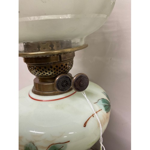 8 - VICTORIAN OIL LAMP WITH BRASS PEDASTEL COLOURED GLASS BOWL DECORTED WITH FLOWERS AND A GREEN ETCHED ... 