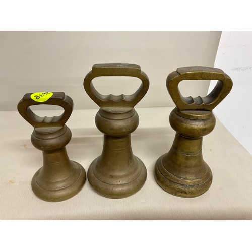 21 - 3 VINTAGE BRASS BELL WEIGHTS ALONG WITH POSTAGE BRASS WIEGHTS IN HOLDER NOT COMPLETE + SET OF BRASS ... 