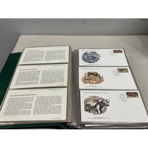 43 - THE OFFICIAL COLLECTION OF WORLD WILDLIFE FIRST DAY COVERS ALONG WITH THREE BOXED STAMP ALBUMS AND C... 