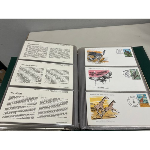 43 - THE OFFICIAL COLLECTION OF WORLD WILDLIFE FIRST DAY COVERS ALONG WITH THREE BOXED STAMP ALBUMS AND C... 