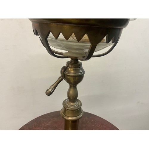 51 - VICTORIAN STANDARD OIL LAMP ON BRASS TRIPOD BASE CAST IRON STRETCHER AND RED GRANITE CENTRE - LAMP B... 