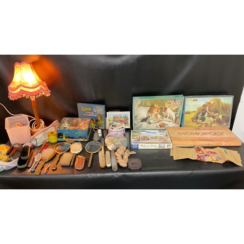 TWO BOXES OF ODDS TO INCLUDE TABLE LAMPS, DRESSING TABLE SET, JIGSAWS ETC