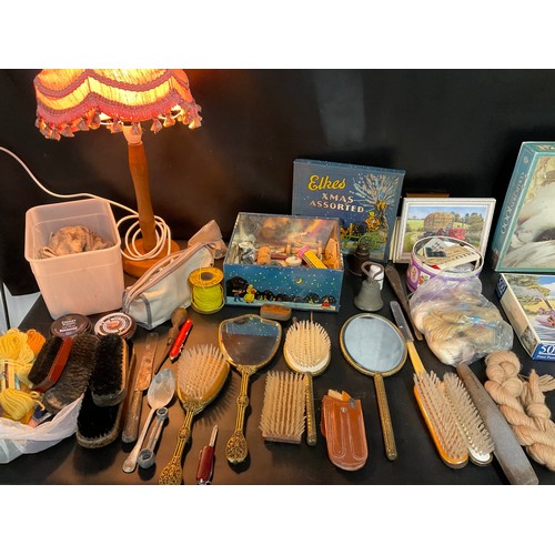 TWO BOXES OF ODDS TO INCLUDE TABLE LAMPS, DRESSING TABLE SET, JIGSAWS ETC