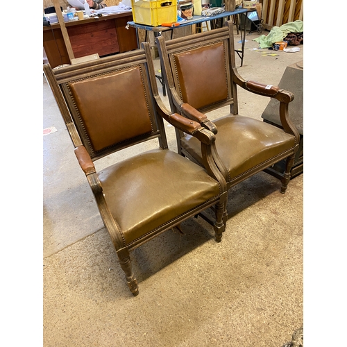 931 - 2 leather upholstered carver chairs