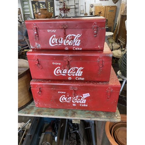 1116 - Seat of 3 Coca Cola trunks