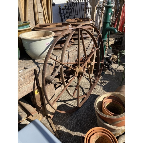 621 - Pair of 4ft iron machinery wheels