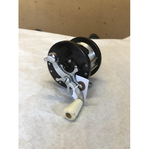 15 - Penn multiplier reel & line