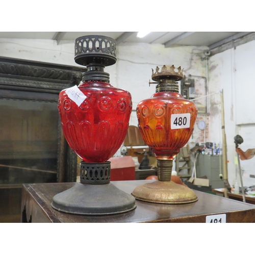 480 - Pair red glass oil lamps