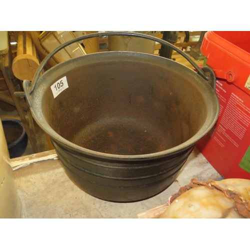 105 - Cast iron crock with handle