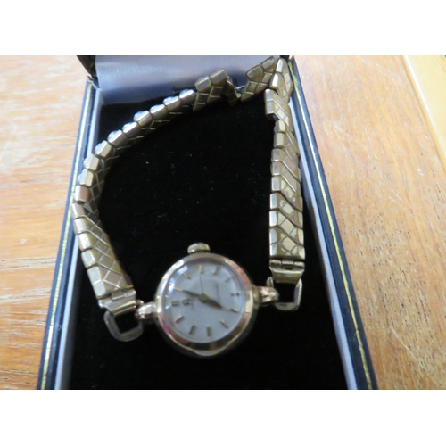 696 - Omega gold ladies wrist watch