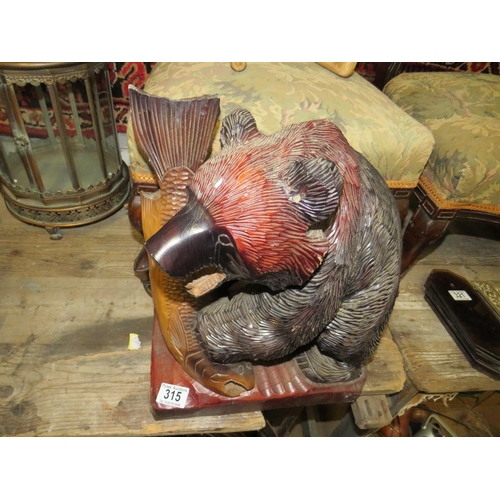 315 - Carved wood bear with fish height 16